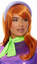 Long light orange wig with slight curls and side swept bangs. Unisex synthetic wig.
