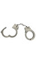 Plastic adjustable toy handcuffs with safety release button. Please note: these do not come with a key, you simply push the release lever down to open the cuffs. Cuffs measure about 3.5" from top to bottom of each cuff, and the inside diameter is about 2" at the standard adjustment. They can be adjusted smaller or larger from there. They measure about 10.5" end to end with the chain fully extended.
