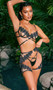 Ebony Rose set includes bra features illusion sheer tulle fabric with floral guipure lace trim, underwire demi cups, strappy accents with three ring metal hardware, adjustable shoulder straps, and cage style back with hook and eye closure. Matching chaps feature elastic waist and leg openings, open gusset and back hook closure. Matching stretch satin thong panty with cotton gusset also included. Three piece set.