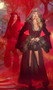 Red Riding Hood costume includes long floor length velvet coat with hood, faux fur trim, open flyaway front, bell sleeves, and front zipper closure.  High waisted shorts also included. Two piece set.