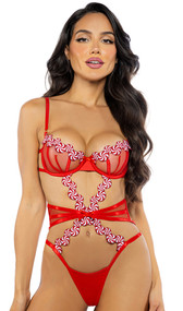 Satin and mesh teddy features embroidered peppermint candy trim, underwire balconette cups, satin ribbon bow accents, steel boning, open midsection, adjustable shoulder straps, strappy thong back with cotton gusset, and hook and eye back closure.