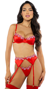 Satin bra features embroidered peppermint candy trim, underwire balconette cups, satin ribbon bow accent, adjustable shoulder straps and cage style back with hook and eye closure. Matching garter belt features adjustable garter straps and back hook closure. Matching thong with cotton gusset also included. Three piece set.