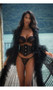 Floor length sheer robe with ruffled trim, long sleeves and tiered bottom.