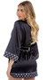 Satin short length robe features Playboy bunny head logo print trim, contrast piping, patch pocket, collar, three quarter length sleeves with cuffs, and waist sash with tie closure.