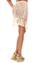 Crochet pull on mini skirt features long fringe trim.