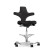 HÅG Capisco 8106 ergonomic saddle chair in black upholstery with white base and foot ring