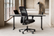 HÅG SoFi ergonomic mesh chair in a modern home office setup with desk and accessories