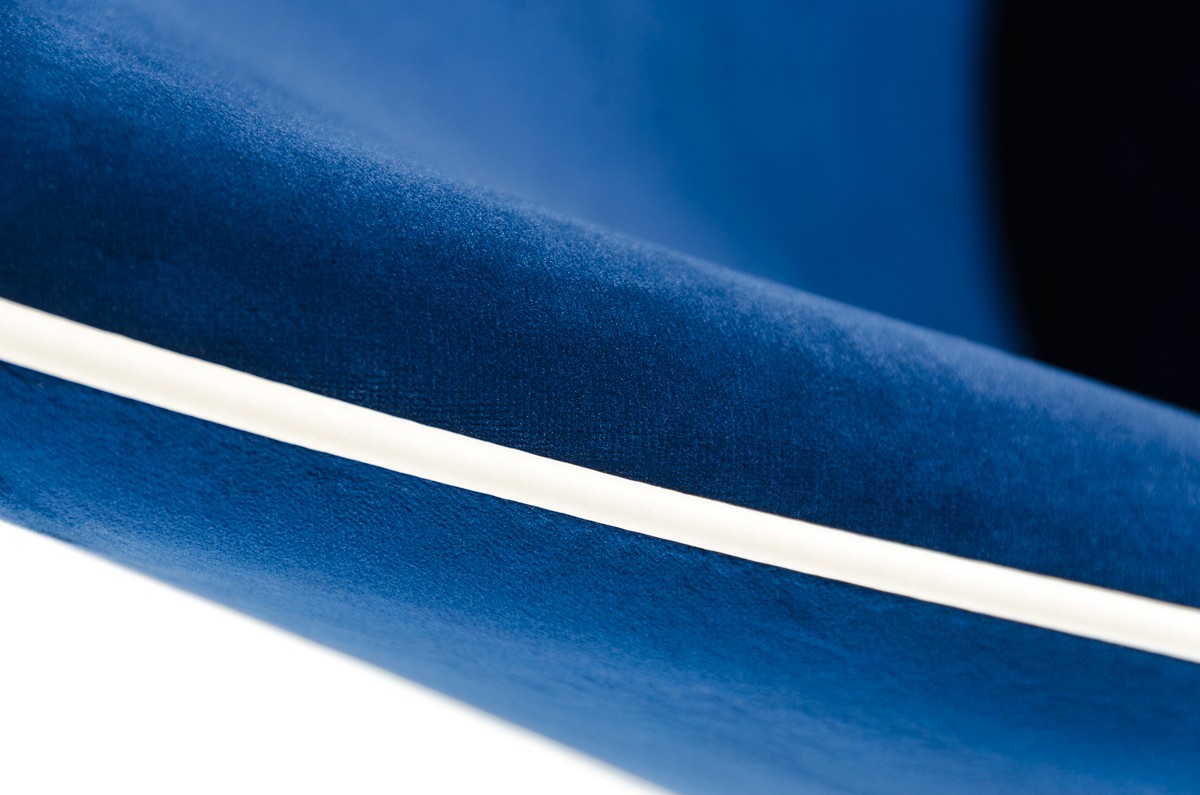 close up shot of the zephyr velvet blue dining chairs