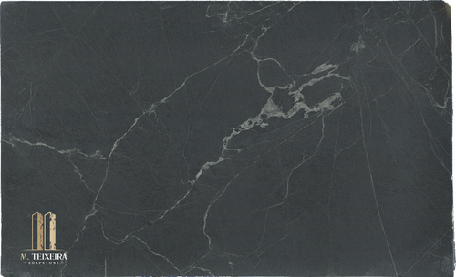Stormy Black LOT 2898
Size 130″ x 79″ x 3cm

NJ Location

Discounted Price $1588.00 Price is valid for Pick Up In Glen Rock, NJ ONLY. Please call us for a quote for shipping , fabrication or installation.

Product Overview:
Aesthetic Features : Before mineral oil treatment, this is a dark  gray soapstone with light veining. After mineral oil treatment is becomes a much darker charcoal gray/black and the lighter veining is pronounced. This timeless soapstone countertop exudes elegance and sophistication.

Perfectly balancing luxury with a commanding presence, it will be a standout feature in any space.

Applications: Ideal for both indoor and outdoor installations.

Common Uses:

Outdoor Spaces: Perfect for outdoor kitchens, BBQ surrounds, patio bars, poolside counters, garden workstations, beverage stations, fire pit surrounds, buffet stations, backyard prep areas, outdoor sinks, wet bars, rooftop terrace countertops, and pizza oven surrounds.
Indoor Spaces: Excellent for kitchen countertops, bathroom vanities, kitchen islands, laundry room counters, wet bars, tabletops, backsplashes, waterfall edges, and shower surrounds.
Design Style: Classic Black Soapstone

Product Information:
Stain Resistance

Exceptional Resistance: Non-porous surface eliminates the need for sealing.
Scratch Resistance

Good Protection: Harder than average soapstone due to its lower Talc contents.
Heat Resistance

Superior Performance: Handles high temperatures, making it perfect for kitchen use.
Hardness

Harder Than Average Soapstone 
Periodic Maintenance

No Sealing Needed: Non-porous, though periodic oiling is suggested to maintain darker  appearance.
Country of Origin

Brazil
Item Weight

Density: 22 lbs per square foot.