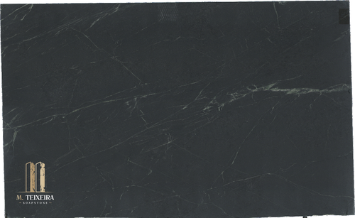 Stormy Black Soapstone:128″ x 78″ x 3cm

Material Finish: Honed

Multiple Slabs available.

Product Overview:
Aesthetic Features : Before mineral oil treatment, this is a dark  gray soapstone with light veining. After mineral oil treatment is becomes a much darker charcoal gray/black and the lighter veining is pronounced. This timeless soapstone countertop exudes elegance and sophistication.

Perfectly balancing luxury with a commanding presence, it will be a standout feature in any space.

Applications: Ideal for both indoor and outdoor installations.

Common Uses:

Outdoor Spaces: Perfect for outdoor kitchens, BBQ surrounds, patio bars, poolside counters, garden workstations, beverage stations, fire pit surrounds, buffet stations, backyard prep areas, outdoor sinks, wet bars, rooftop terrace countertops, and pizza oven surrounds.
Indoor Spaces: Excellent for kitchen countertops, bathroom vanities, kitchen islands, laundry room counters, wet bars, tabletops, backsplashes, waterfall edges, and shower surrounds.
Design Style: Classic Black Soapstone

Product Information:
Stain Resistance

Exceptional Resistance: Non-porous surface eliminates the need for sealing.
Scratch Resistance

Good Protection: Harder than average soapstone due to its lower Talc contents.
Heat Resistance

Superior Performance: Handles high temperatures, making it perfect for kitchen use.
Hardness

Harder Than Average Soapstone 
Periodic Maintenance

No Sealing Needed: Non-porous, though periodic oiling is suggested to maintain darker  appearance.
Country of Origin

Brazil
Item Weight

Density: 22 lbs per square foot.