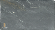 Size 127″ x 69″ x 3cm

Multiple Slabs available.

Product Overview:
Aesthetic Features : Before mineral oil treatment, this is a dove gray soapstone with darker swirls  in almost. After mineral oil treatment is becomes a much darker charcoal gray with a hint of green. This timeless soapstone countertop exudes elegance and sophistication.

Perfectly balancing luxury with a commanding presence, it will be a standout feature in any space.

Applications: Ideal for both indoor and outdoor installations.

Common Uses:

Outdoor Spaces: Perfect for outdoor kitchens, BBQ surrounds, patio bars, poolside counters, garden workstations, beverage stations, fire pit surrounds, buffet stations, backyard prep areas, outdoor sinks, wet bars, rooftop terrace countertops, and pizza oven surrounds.
Indoor Spaces: Excellent for kitchen countertops, bathroom vanities, kitchen islands, laundry room counters, wet bars, tabletops, backsplashes, waterfall edges, and shower surrounds.
Design Style: Classic Soapstone with a hint of green

Product Information:
Stain Resistance

Exceptional Resistance: Non-porous surface eliminates the need for sealing.
Scratch Resistance

Moderate Protection: Soft material; minor scratches can be easily repaired.
Heat Resistance

Superior Performance: Handles high temperatures, making it perfect for kitchen use.
Hardness

Softer Soapstone 
Periodic Maintenance

No Sealing Needed: Non-porous, though periodic oiling is suggested to maintain darker  appearance.
Country of Origin

Brazil
Item Weight

Density: 22 lbs per square foot.