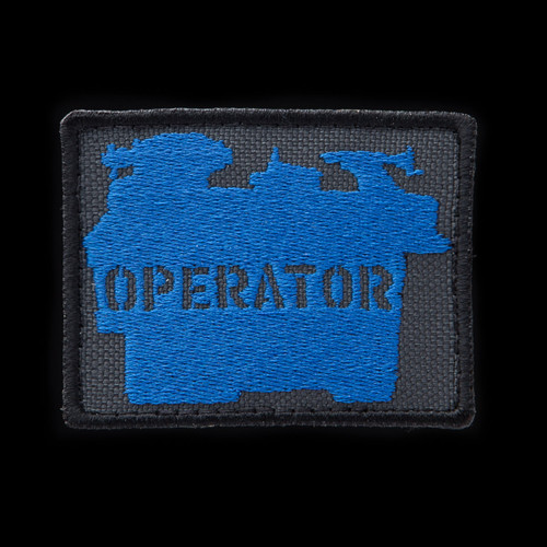 Lathe Operator Patch: charcoal background, blue artwork, black border