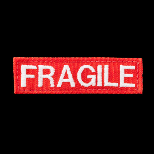Fragile patch: red background, glow-in-the-dark white text