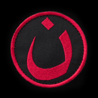 Nün patch, black background, red embroidery