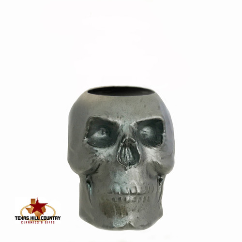 Ceramic skull holder in burnished steel glaze.