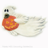 White Ghost holding carved Jack O'Lantern pumpkin tea bag holder or Halloween kitchen decor.