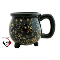Black cauldron mug with cosmic burst glaze.
