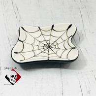 Petite free form dish with hand painted spider cobweb design.
