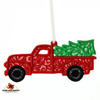 Red pickup truck ornament with green tree.