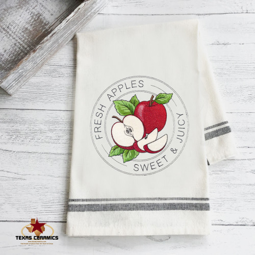 Fresh Apples Stamp Embroidery design on natural cotton towel with black trim.