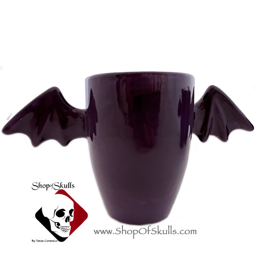 Bat wing handle mug in glossy purple glaze for hot or cold beverages.  Made by Texas Ceramics.