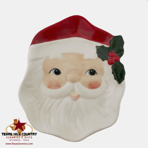 Santa spoon rest or cookie dish with traditional red cap, green holly, white beard. Made in the USA by Texas Ceramics.
