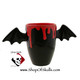 Bat wing handle mug in glossy black glaze with red drips over edge for hot or cold beverages.  Made by Texas Ceramics.