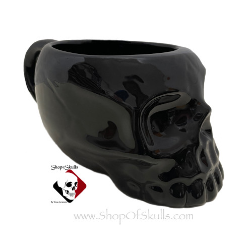 Black skull mug holds 16 ounces.
