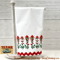 Indian Paintbrush wildflower border embroidery on white woven cotton towel with red trim, Made in Central Texas.