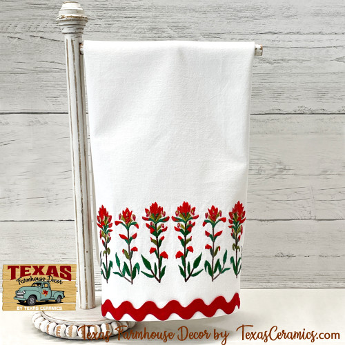 Indian Paintbrush wildflower border embroidery on white woven cotton towel with red trim, Made in Central Texas.
