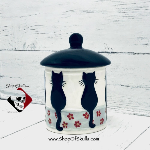 Cat treat canister with lid.
