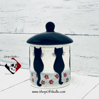 Cat treat canister with lid.