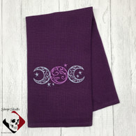Triple Moon Symbol Embroidery on a Violet cotton waffle weave towel.
