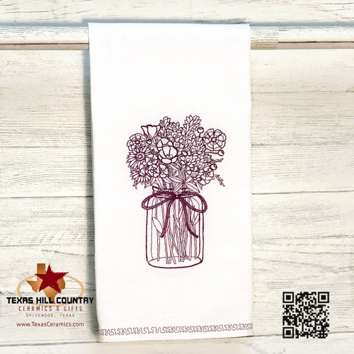 Cotton kitchen dish or tea towel with embroidered Texas Wildflowers in a mason jar.