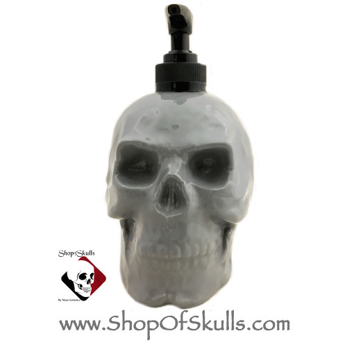 Gray skull refillable soap dispenser.
