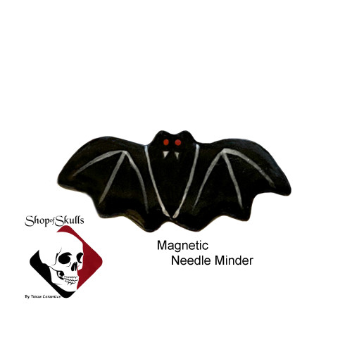 Black vampire bat magnetic needle minder hand made in the USA.  Can also double as a lapel pin.