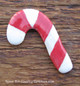 Red and white candy cane magnetic needle minder hand made in the USA.
