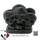 Solid black skull napkin holder or mail letter rack on rock base.