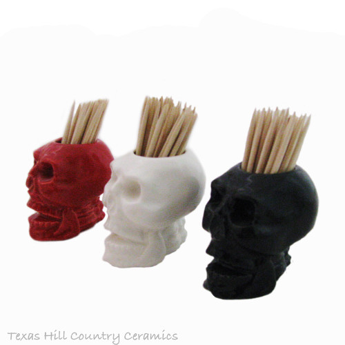 Small skull toothpick holder in assorted colors.