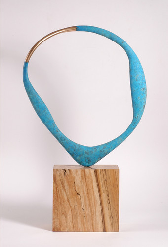 The bronze part has a natural bronze section flanked by oxidized surfaces and the piece freely rotates on the spalted Beech base. This allows the collector to choose any number of views as the piece is asymmetrical.