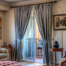 100% Silk drapes (shown in dove grey) exclusively for LAUREL AT SUNSET.  Priced per panel. Dry clean only.