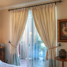 100% silk drapes (shown in natural and seafoam) exclusively for LAUREL AT SUNSET. Priced per panel. Dry clean only.