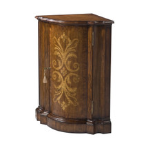 A hickory corner cabinet by Theodore Alexander
