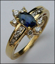 Sapphire .56ct Ring with .48ct Diamonds in Yellow Gold
