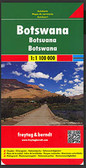 Botswana at 1:1,100,000 on an indexed map from Freytag & Berndt prominently highlighting the country’s national parks, game reserves and topographic features such as salt lakes, plus a street plan of central Gaborone. 

The map has a plan base with some relief shading in the more hilly parts of the country. Salt lakes and marshes are marked, as well as seasonal rivers and lakes. National parks and game reserves are clearly highlighted.

Road network indicates cart tracks and shows distances on main routes and locations of petrol stations. Border crossing points show their opening times. Railway lines are included; local airports are marked; and veterinary cordon fences and locations of quarantine camps are prominently shown. The map also indicates internal administrative boundaries and names of the provinces. 

Icons highlight locations of tourist lodges and camp sites, many annotated with their names. Also marked are places of interest such as UNESCO World Heritage sites, caves, hot springs, archaeological sites, etc. Latitude and longitude lines are drawn at 1° intervals. The index is next to the map. Map legend includes English 

Also provided is a street plan of central Gaborone, showing locations of some of the governmental offices, embassies etc.