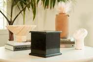 Modern Black Marble Cremation Urn for Ashes - This traditional black marble urn is hand crafted from 100% pure marble.  Each urn is perfectly turned from a solid piece of marble and polished to shine.  Black is a classic color of timeless beauty.  The main characteristic of this black marble are the purity, deep blacks and minimal white veining. Quarried and made from 100% real natural marble. Hand crafted from a solid piece of marble and polished to shine. Because it is natural, the color and pattern in each urn will vary.  The bottom is lined with felt to prevent scratches and provide stability and includes a threaded lid to secure ashes.

It’s the perfect vessel as a keepsake for display in your home, niche, funeral, columbarium, burial, scattering ashes, or as a reminder and in remembrance of their love and spirit.