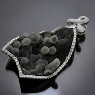 18 karat White Gold, Diamond Halo and Curved Stalactite Pendant