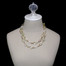 White and champagne, freshwater pearls mix with pale, natural stones along a gold-colored chain - addison