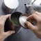 A scene of opening the lid of a tea caddy