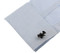 black bat-man bat cufflinks shown displayed on a white french cuff shirt sleeve